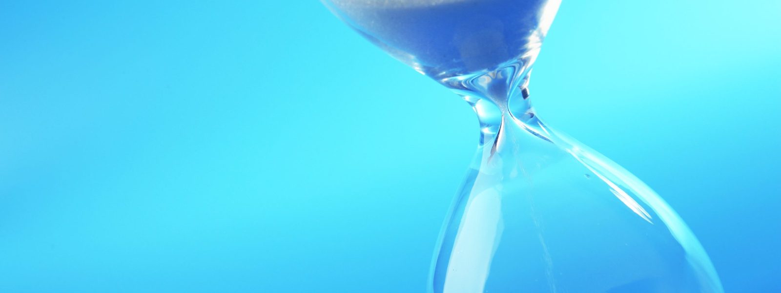 Hourglass on blue background